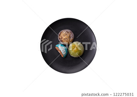 Delicious colorful asian mochi sweets with rice dough shell and fruit filling Delicious colorful asian mochi sweets with rice dough shell and fruit filling 122275031