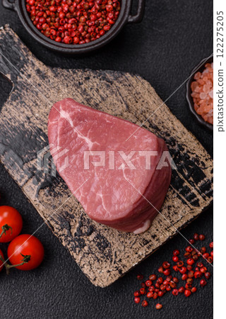 Ribeye steak raw with salt, spices and herbs 122275205