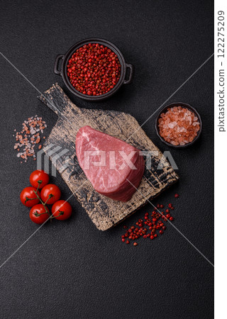 Ribeye steak raw with salt, spices and herbs Ribeye steak raw with salt, spices and herbs 122275209