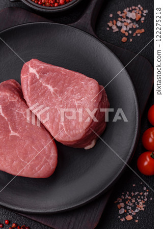 Ribeye steak raw with salt, spices and herbs 122275218