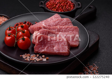 Juicy beef cut into slices with salt, spices and herbs Juicy beef cut into slices with salt, spices and herbs 122275240