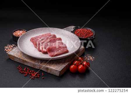 Juicy beef cut into slices with salt, spices and herbs Juicy beef cut into slices with salt, spices and herbs 122275254