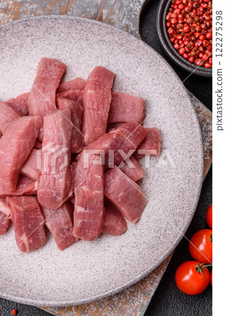 Juicy beef cut into slices with salt, spices and herbs Juicy beef cut into slices with salt, spices and herbs 122275298