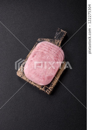 Ham, spam with salt, spices and herbs cut into slices Ham, spam with salt, spices and herbs cut into slices 122275304