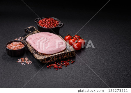 Ham, spam with salt, spices and herbs cut into slices Ham, spam with salt, spices and herbs cut into slices 122275311