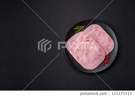 Ham, spam with salt, spices and herbs cut into slices Ham, spam with salt, spices and herbs cut into slices 122275315