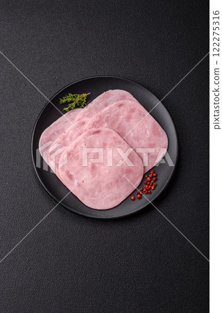 Ham, spam with salt, spices and herbs cut into slices 122275316