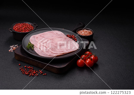Ham, spam with salt, spices and herbs cut into slices Ham, spam with salt, spices and herbs cut into slices 122275323