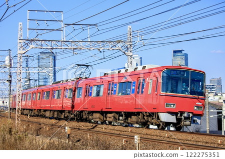 Meitetsu 3500 series train running with Nagoya's skyscrapers in the background 122275351