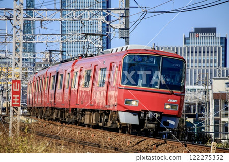 Meitetsu 3500 series train running with Nagoya's skyscrapers in the background 122275352