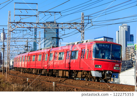 Meitetsu 3500 series train running with Nagoya's skyscrapers in the background 122275353