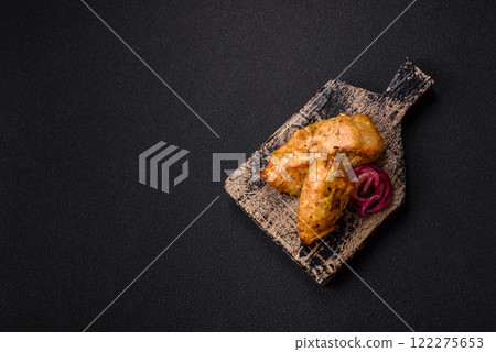 Chicken fillet pieces marinated with salt and spices 122275653