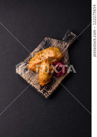 Chicken fillet pieces marinated with salt and spices 122275654