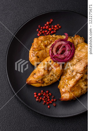 Chicken fillet pieces marinated with salt and spices Chicken fillet pieces marinated with salt and spices 122275671