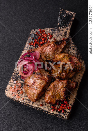 Pieces of beef meat cut into slices, marinated with salt and spices Pieces of beef meat cut into slices, marinated with salt and spices 122275694