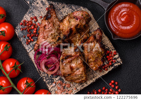 Pieces of beef meat cut into slices, marinated with salt and spices 122275696