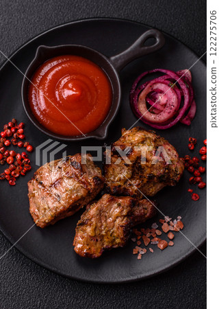 Pieces of beef meat cut into slices, marinated with salt and spices Pieces of beef meat cut into slices, marinated with salt and spices 122275706