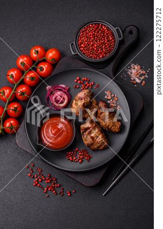 Pieces of beef meat cut into slices, marinated with salt and spices Pieces of beef meat cut into slices, marinated with salt and spices 122275712