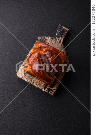 Sweet poppy seed cake on a dark concrete background 122275846