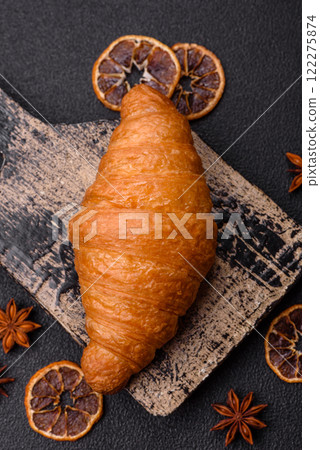 Golden crispy croissant with a sweet creamy fruit filling Golden crispy croissant with a sweet creamy fruit filling 122275874