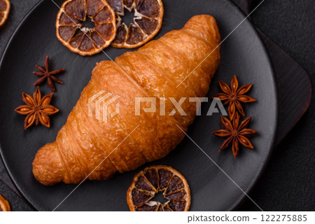 Golden crispy croissant with a sweet creamy fruit filling Golden crispy croissant with a sweet creamy fruit filling 122275885