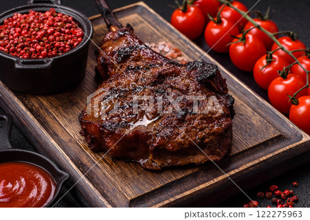 Grilled wagyu beef tomahawk steak with salt, spices and herbs Grilled wagyu beef tomahawk steak with salt, spices and herbs 122275963