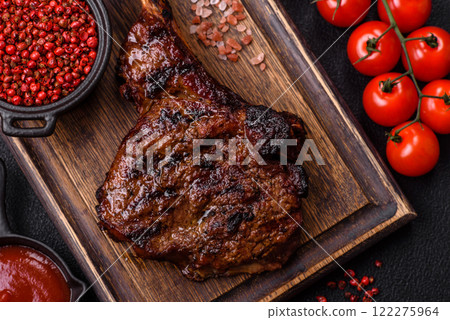 Grilled wagyu beef tomahawk steak with salt, spices and herbs 122275964