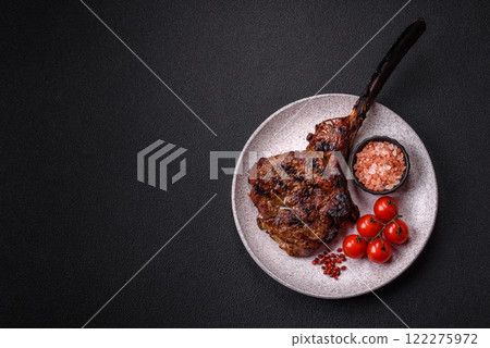 Grilled wagyu beef tomahawk steak with salt, spices and herbs Grilled wagyu beef tomahawk steak with salt, spices and herbs 122275972