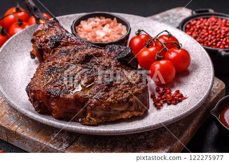 Grilled wagyu beef tomahawk steak with salt, spices and herbs 122275977