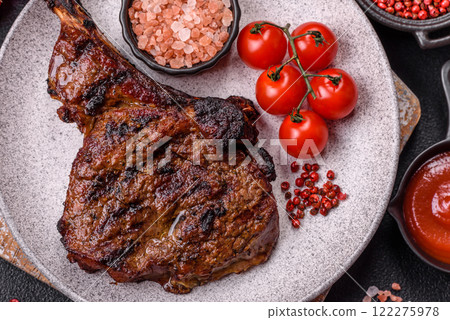 Grilled wagyu beef tomahawk steak with salt, spices and herbs Grilled wagyu beef tomahawk steak with salt, spices and herbs 122275978