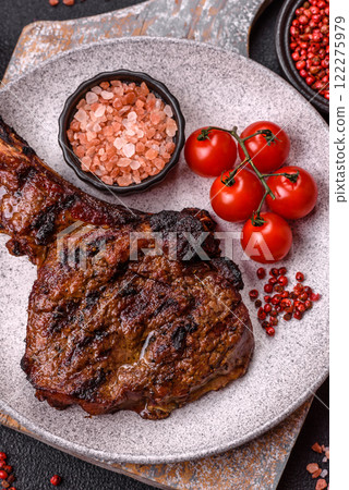 Grilled wagyu beef tomahawk steak with salt, spices and herbs 122275979
