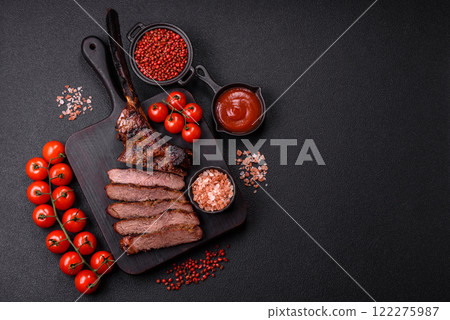 Grilled wagyu beef tomahawk steak with salt, spices and herbs Grilled wagyu beef tomahawk steak with salt, spices and herbs 122275987