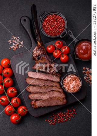 Grilled wagyu beef tomahawk steak with salt, spices and herbs 122275988