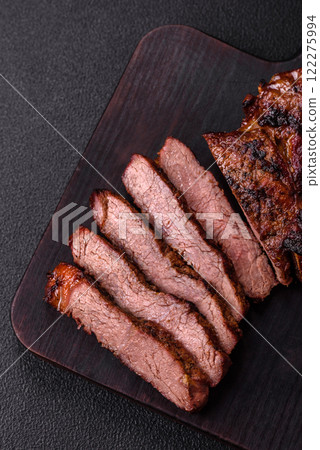 Grilled wagyu beef tomahawk steak with salt, spices and herbs Grilled wagyu beef tomahawk steak with salt, spices and herbs 122275994