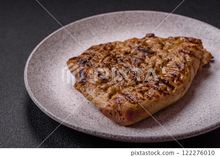 Grilled beef or pork steak with salt, spices and herbs 122276010