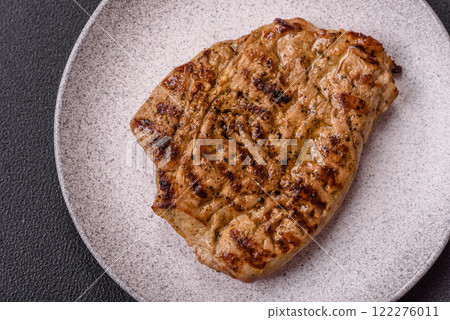Grilled beef or pork steak with salt, spices and herbs 122276011