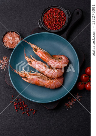 Boiled tiger prawns with salt, spices, herbs and vegetables Boiled tiger prawns with salt, spices, herbs and vegetables 122276091