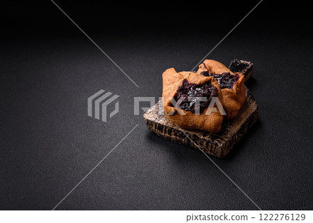 Sweet rye pies with cherries and chocolate 122276129