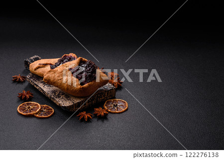 Sweet rye pies with cherries and chocolate 122276138