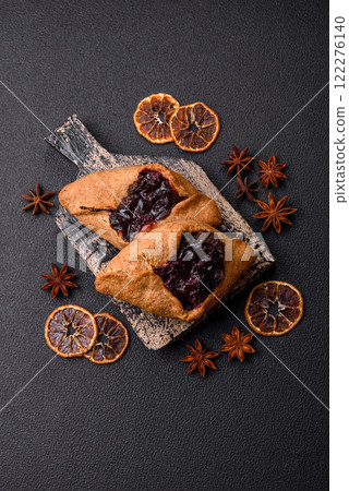 Sweet rye pies with cherries and chocolate 122276140
