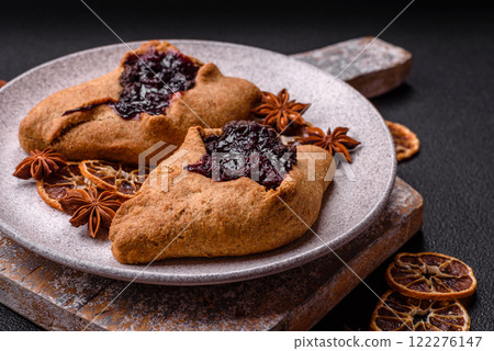 Sweet rye pies with cherries and chocolate 122276147