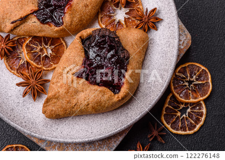 Sweet rye pies with cherries and chocolate 122276148