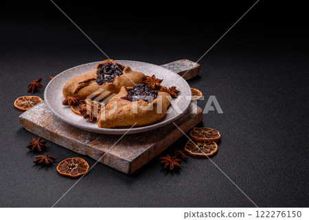 Sweet rye pies with cherries and chocolate 122276150