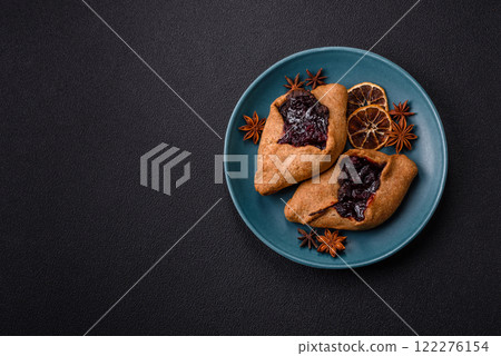 Sweet rye pies with cherries and chocolate 122276154