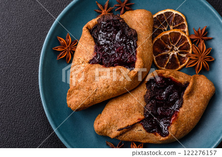 Sweet rye pies with cherries and chocolate 122276157