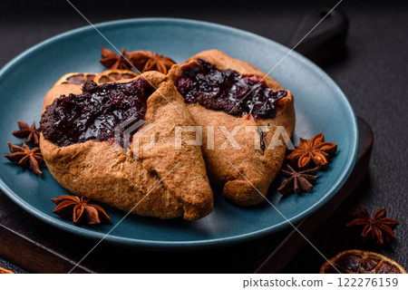 Sweet rye pies with cherries and chocolate 122276159