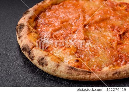 Pizza margherita with cheese, tomatoes, salt, spices and herbs 122276419