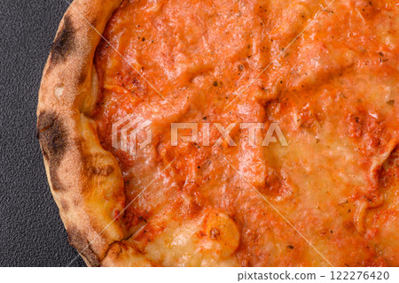 Pizza margherita with cheese, tomatoes, salt, spices and herbs 122276420