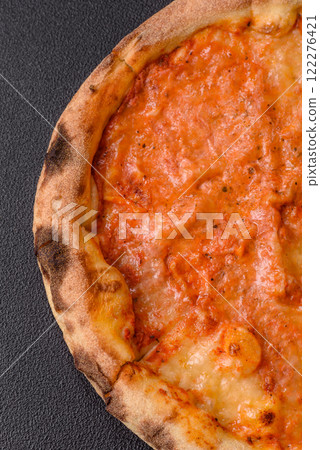 Pizza margherita with cheese, tomatoes, salt, spices and herbs 122276421