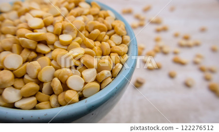 Split Chickpeas Lentils in a Blue Bowl, Closeup 122276512